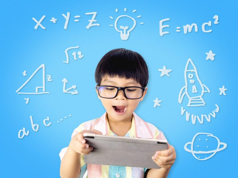 Nerdy Kid with Tablet surround by Math Symbols